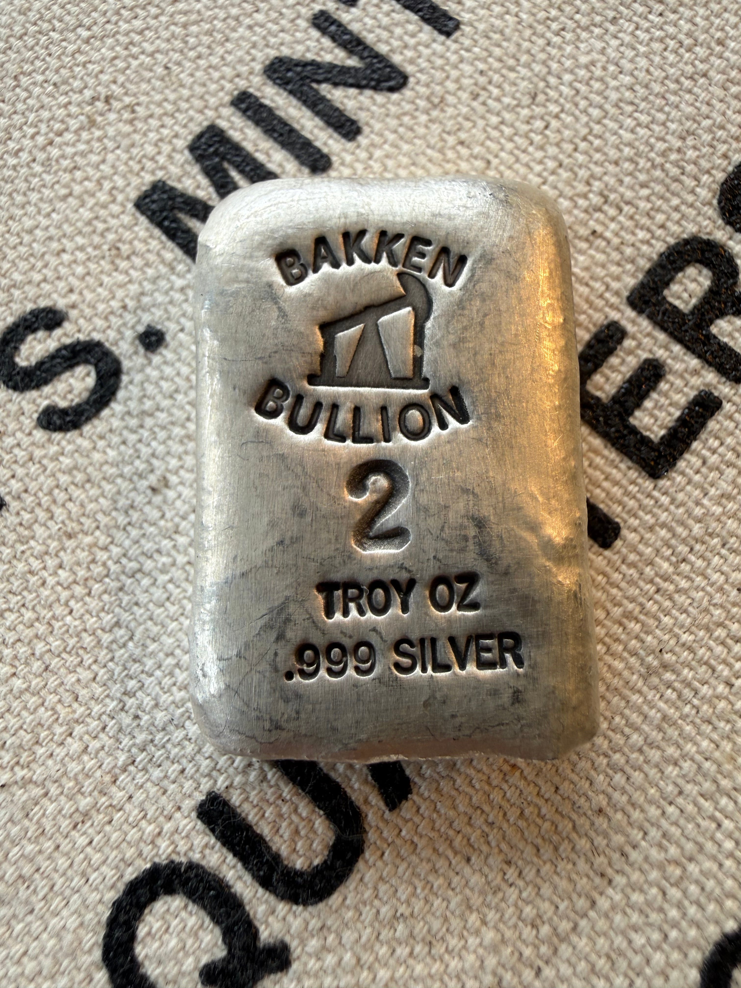 Bakken Bullion Silver Bar - 2ozt, Artisan, Hand Poured, Pumpjack logo