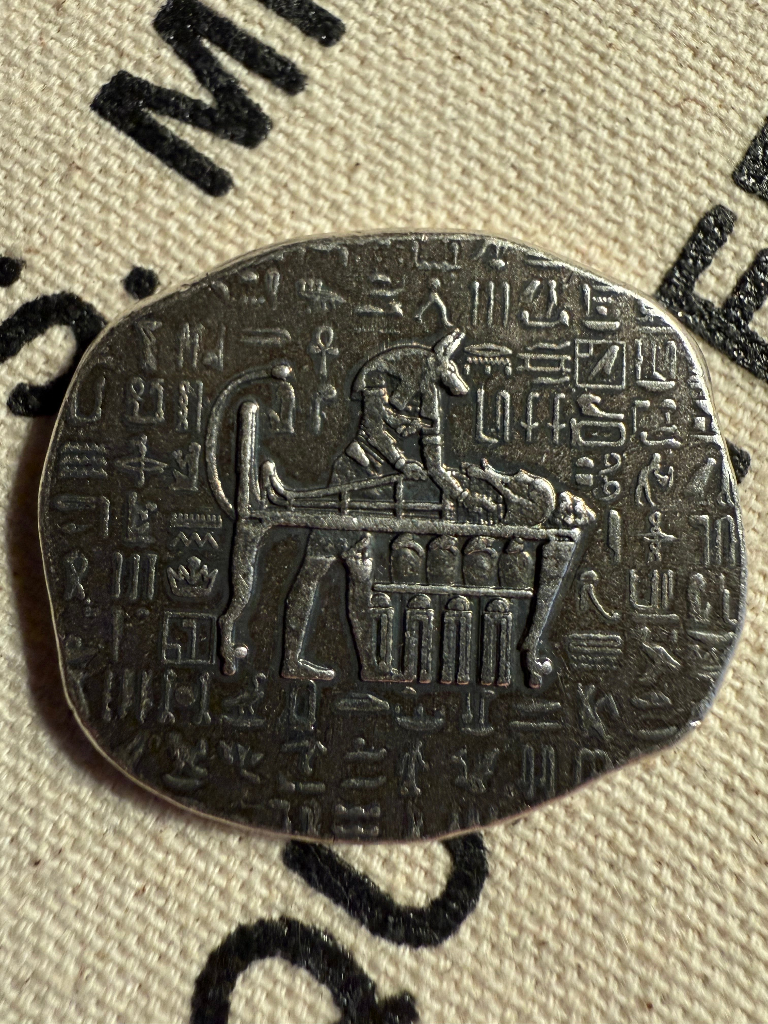 1 oz silver Anubis relic bar, obverse showing jackal-headed god with hieroglyphs