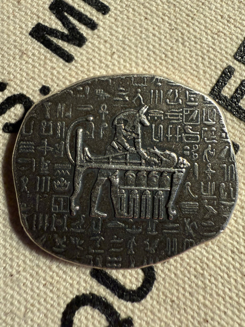 1 oz silver Anubis relic bar, obverse showing jackal-headed god with hieroglyphs