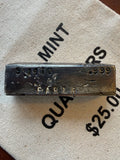 Vintage Silver Bar with 'PAR & R' branding on a textured surface.